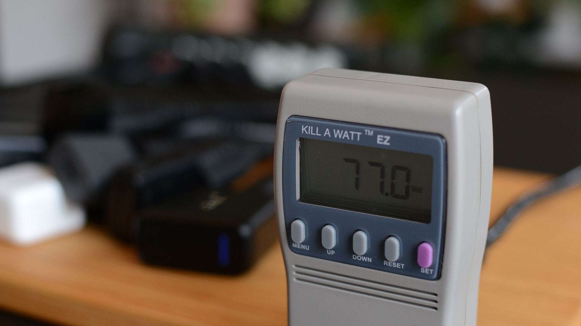 A Kill a Watt meter showing that it takes dozens of chargers to create a 2 watt power load.