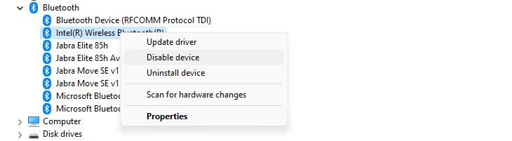 Disabling a Bluetooth device by right-clicking it and using "Disable Device" in the Device Manager.