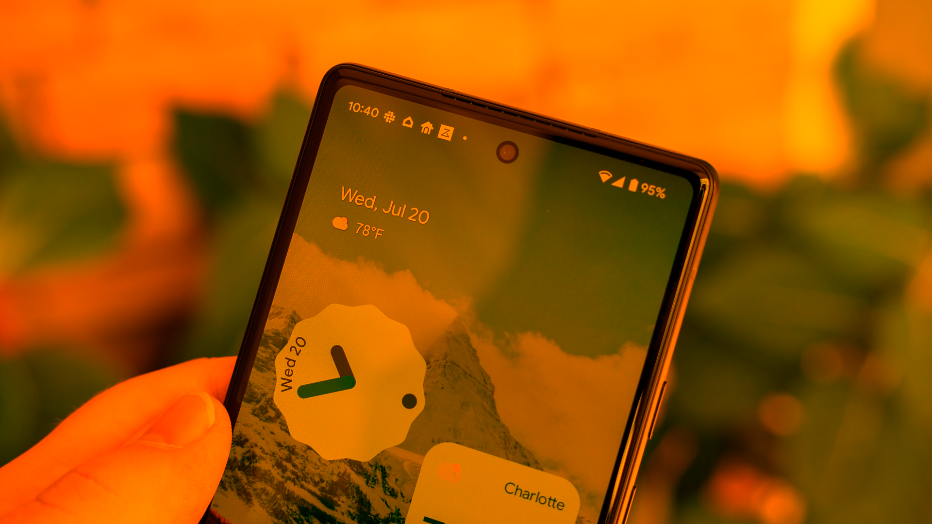 Orange tinted photo of an Android phone.