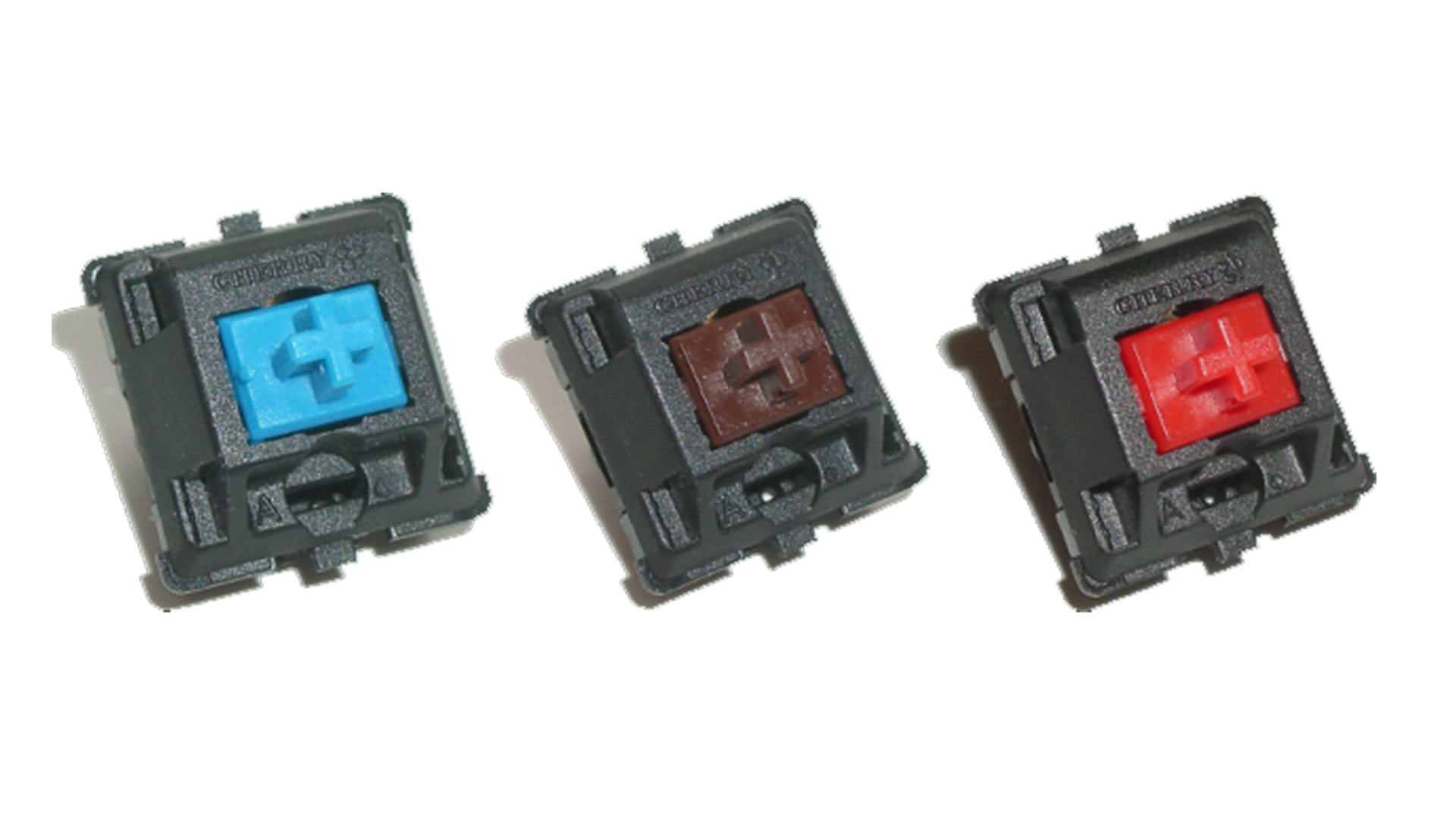Three different keyboard switches (blue, brown, and red) from Cherry