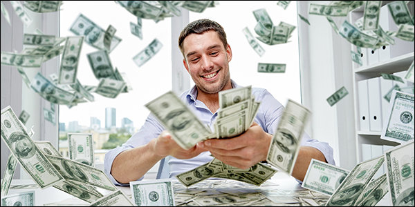 happy man making it rain $100 bills