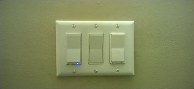 Two smart switches, and a standard paddle switch between them.