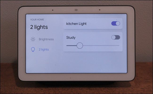 Google Home Hub with smart light controls on screen.