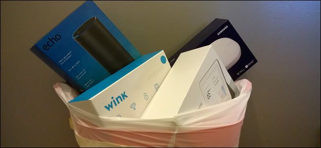 Echo, Wink, Samsung Smartthings, and Google home boxes in a trash can.