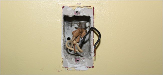 Interiod of a light switch, showing only line and load wires