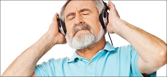 A man enjoying the sweet sound of his noise canceling headphones
