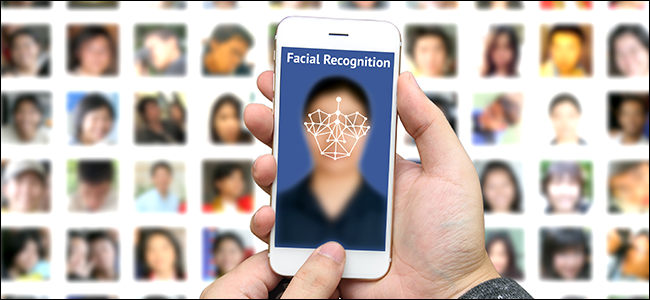 A man using facial recognition tech to identify a subject from a database.