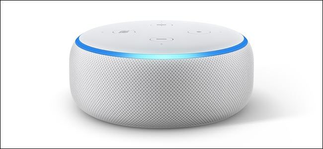 Amazon Echo dot 3 with the light blue LED ring lit up.