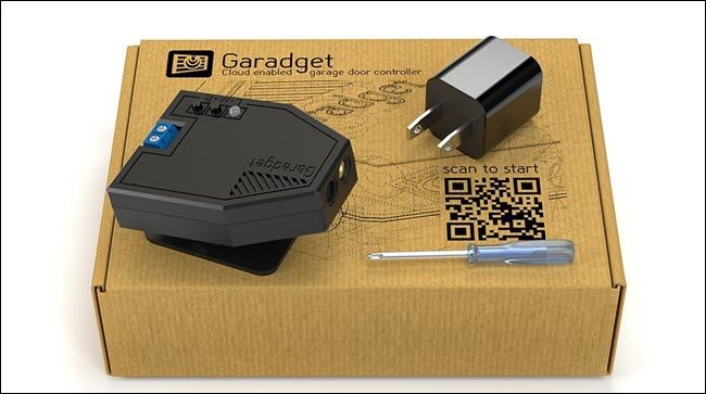 A Garadget box, with laser, plug, and screwdriver.