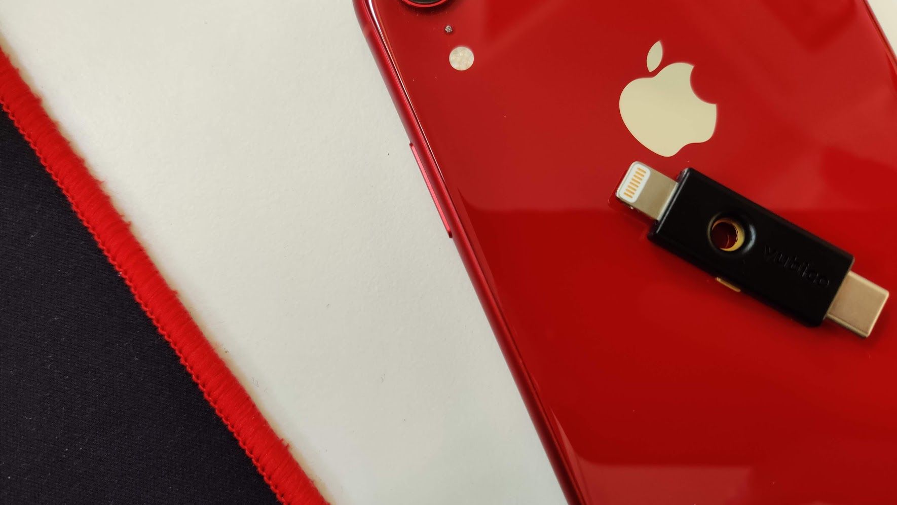 A Black Yubikey 5Ci on a red iPhone