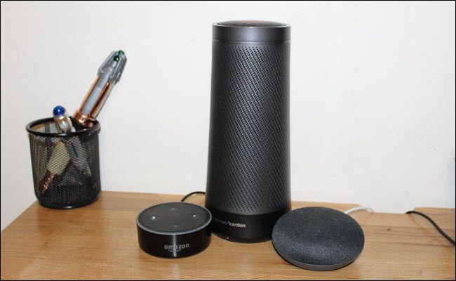 An Amazon Echo, Google Home Mini, and Harmon Kardon Invoke (Cortana speaker)