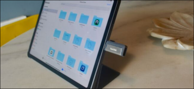iPad Pro showing a USB-C flash drive attached to export photos and backup
