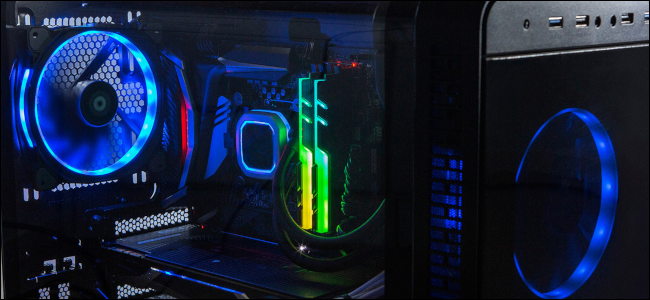 The interior of a gaming PC with blue, yellow, and RGB lighting on its components.