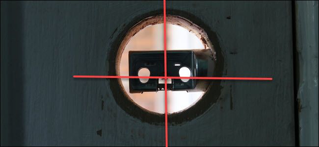 A lock cavity with a bolt in it, and lines crossing through the vertical and horizontal center.