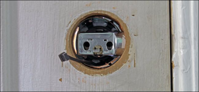 The door lock hole interior, showing the wiring running beneath the bolt assembly.