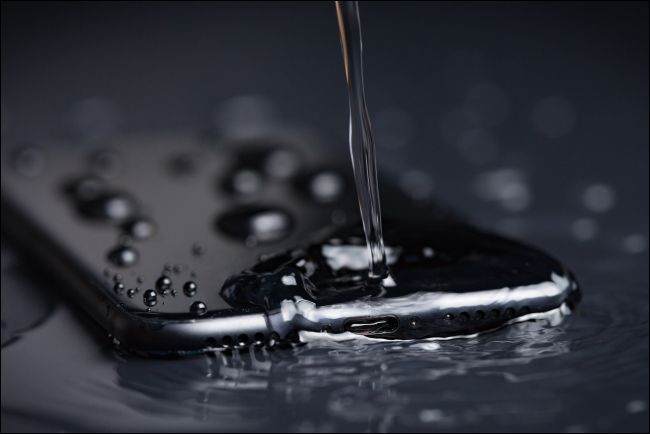 Water pouring onto an iPhone.