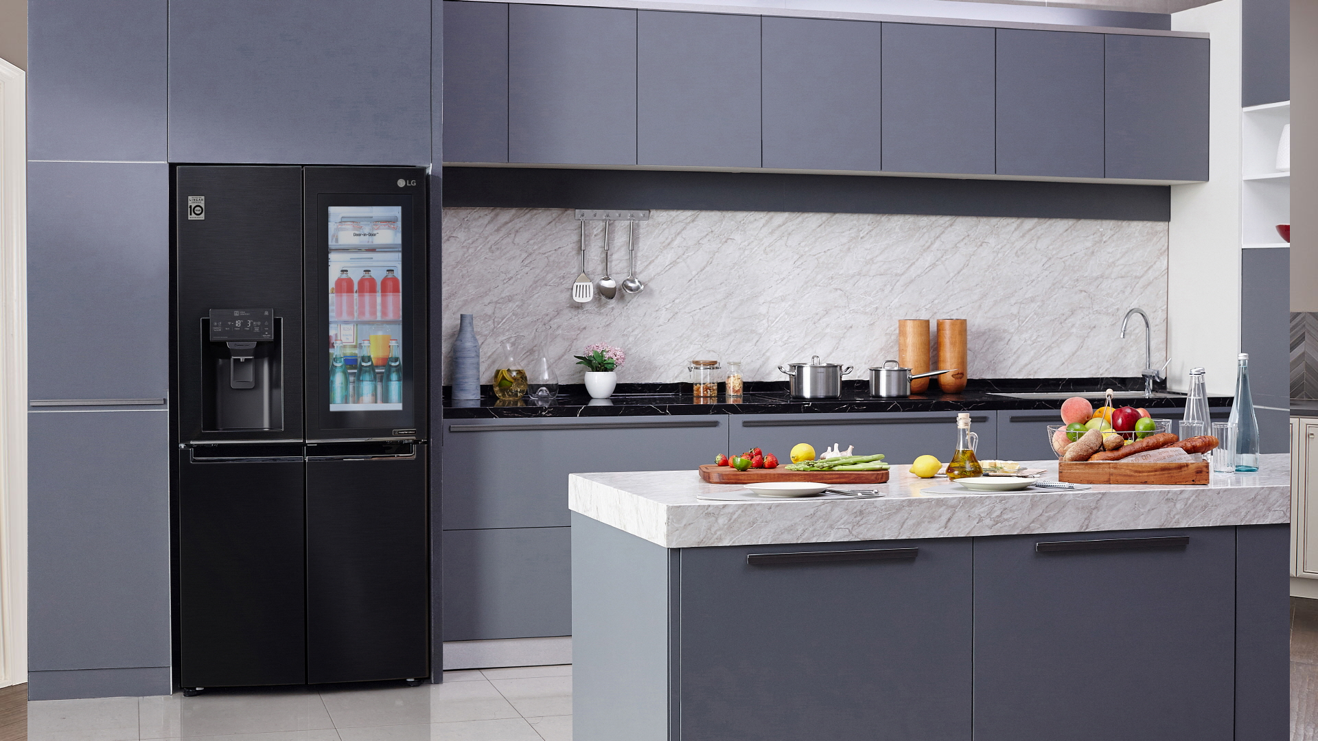 A Samsung smart fridge in a kitchen. 