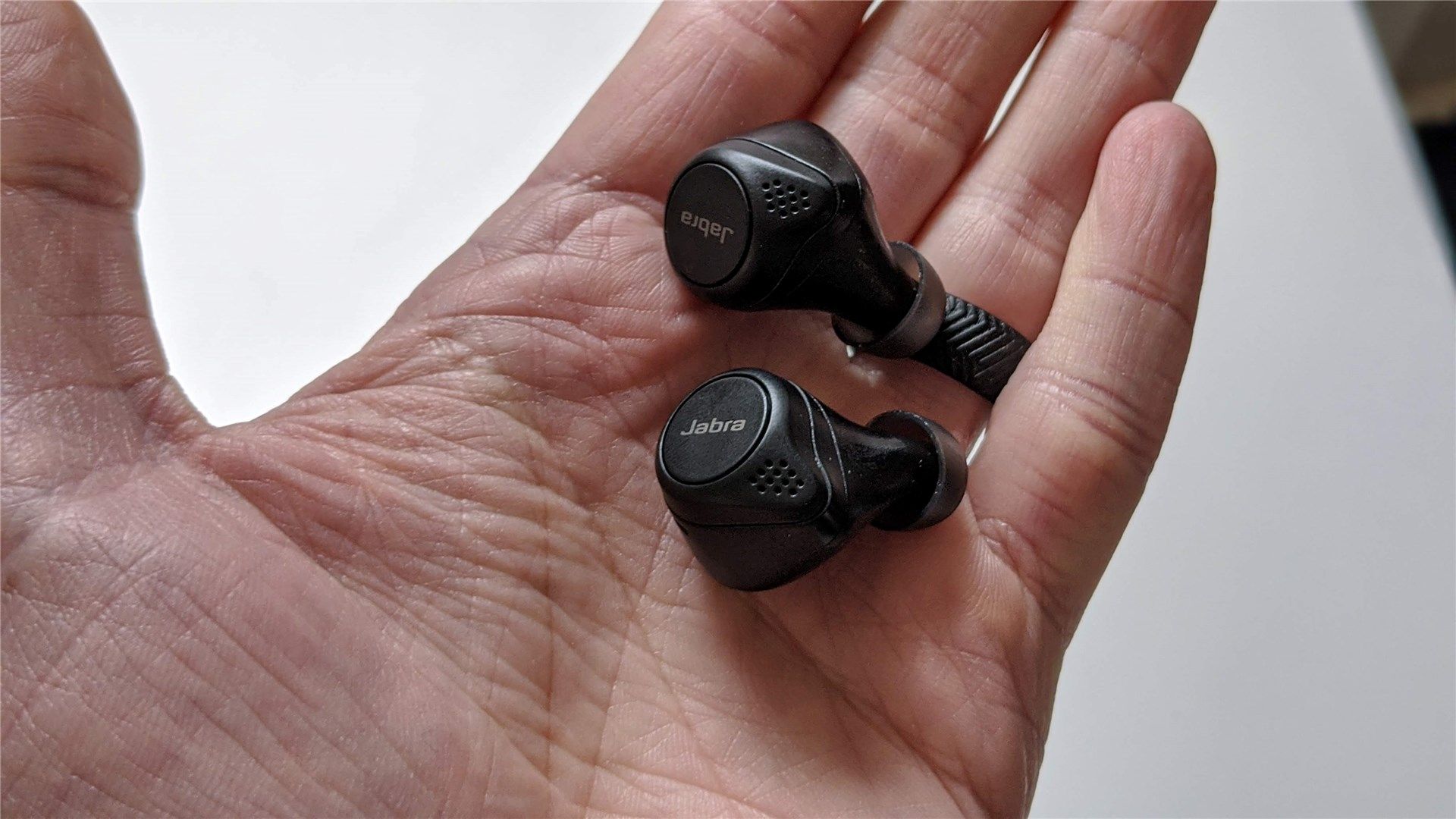 The Jabra Elite 75t in the palm of a hand