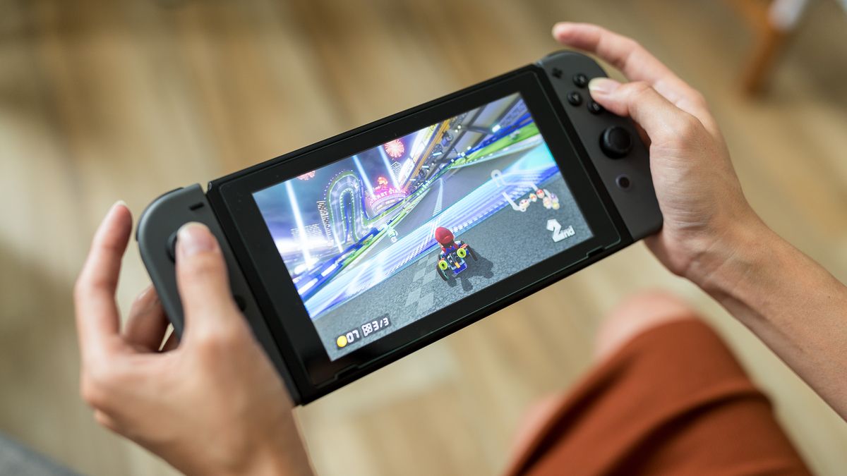 Person playing the Mario Kart video game on a Nintendo Switch