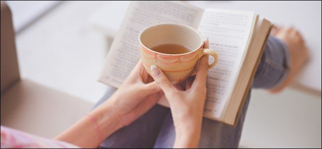 Person Reading Book with Coffee