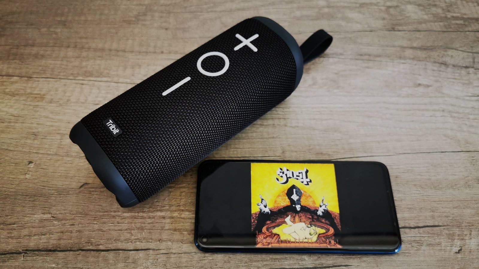 tribit stormbox with smartphone playing music