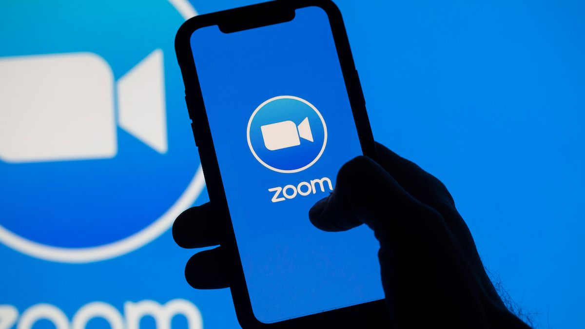 Zoom logo on a smartphone and a computer monitor