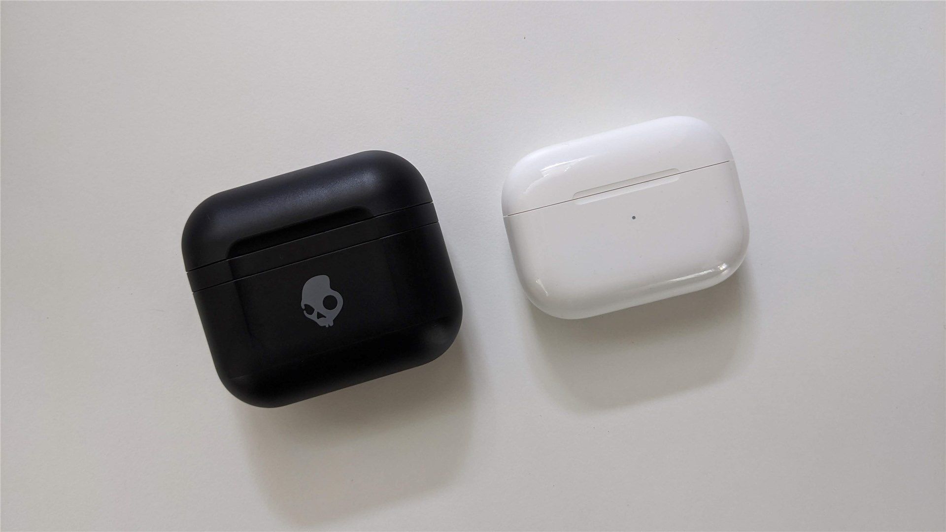 The Skullcandy Indy Fuel case next to the AirPods Pro case