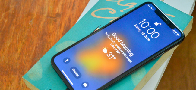 iPhone user viewing the weather on the lock screen