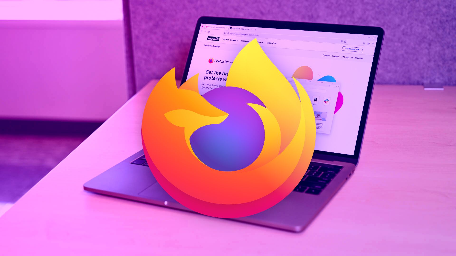 Firefox logo over MacBook Pro
