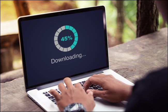 A &quot;Downloading&quot; progress meter on a laptop.