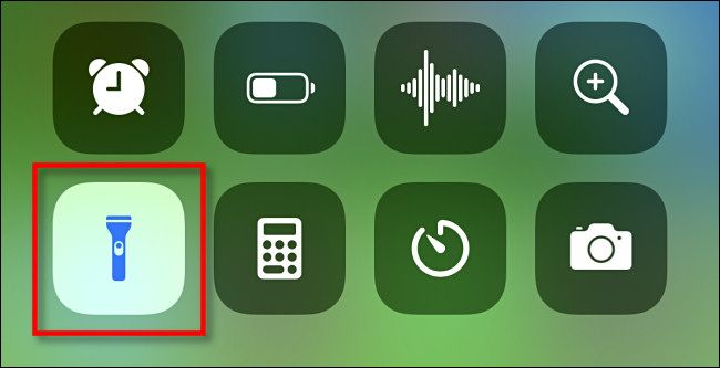 Tap the flashlight icon in iPhone Control Center to turn it off.