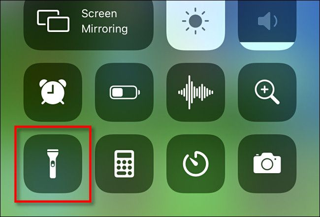 Tap the flashlight icon in iPhone Control Center to turn it on.