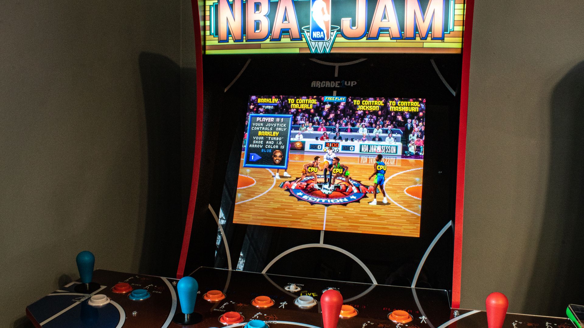 A closeup shot of the NBA Jam machine playing a game.