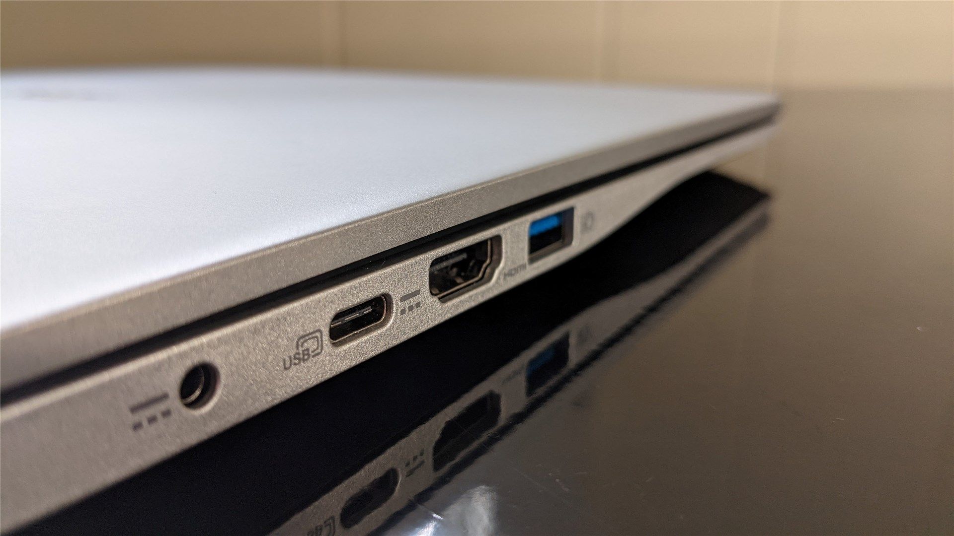 The ports on the left side of the laptop: barrel, usb-c, hdmi, and usb-a 3.0