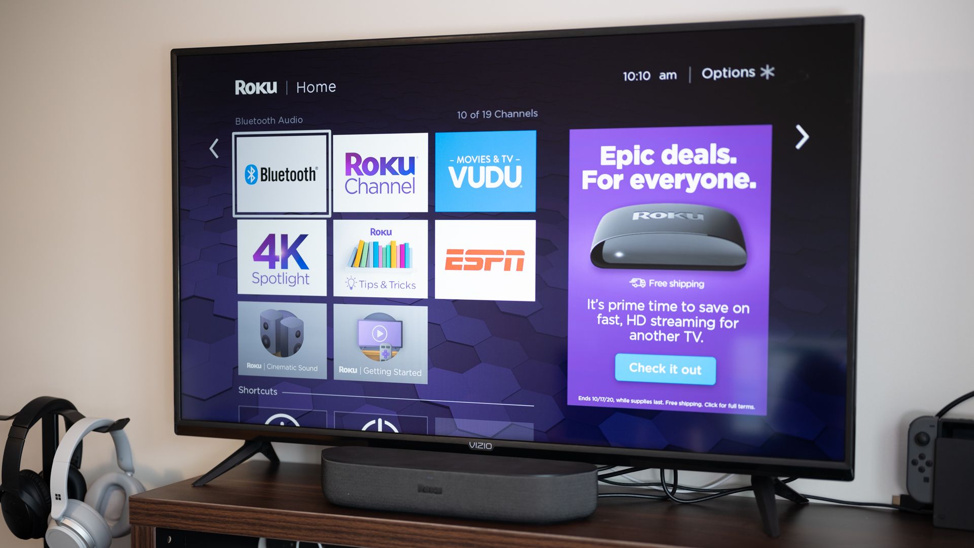 Roku Streambar in front of a television