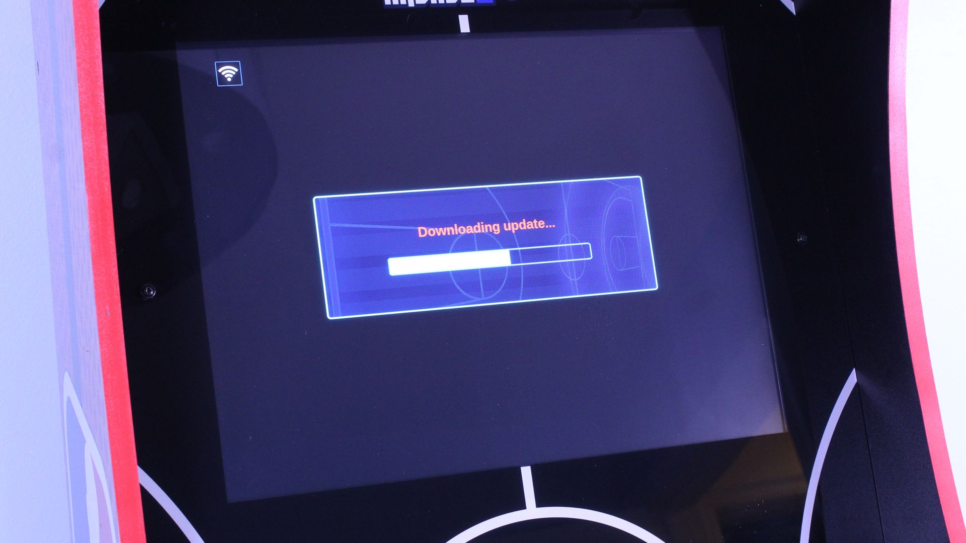 The NBA Jam machine with a &quot;downloading update&quot; dialog