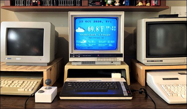 An Atari 800XL computer running a weather app through FujiNet
