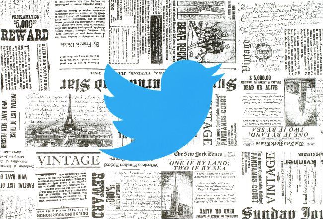 The Twitter logo over some vintage newspapers.