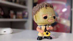 A sample picture from the Pixel 5: A Leatherface collectible on a white desk using portrait mode to blur out the background