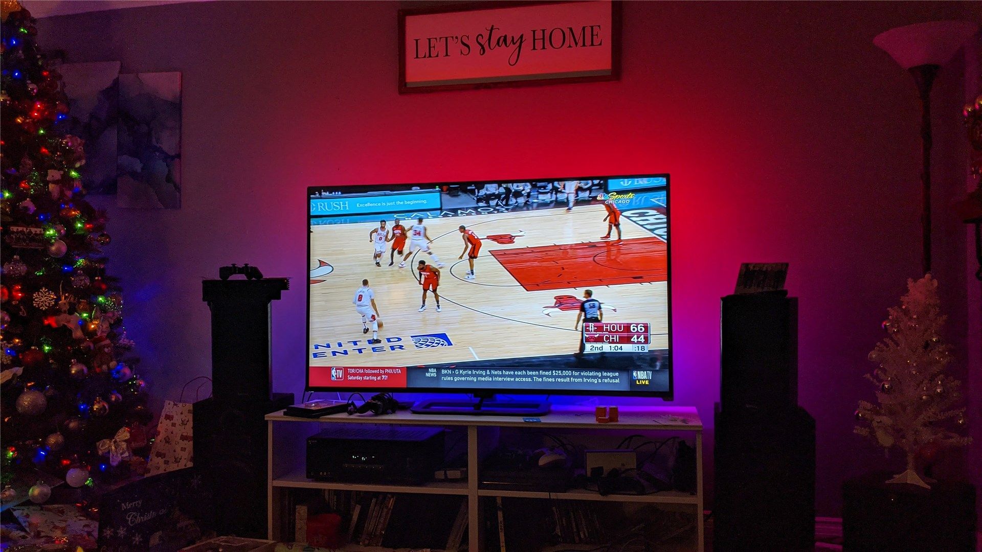 A Chicago Bulls basketball game on the TV with the Immersion displaying red and blue lights