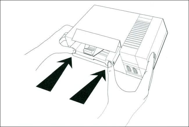 A line diagram of inserting the Game Genie into the NES from the Game Genie manual.