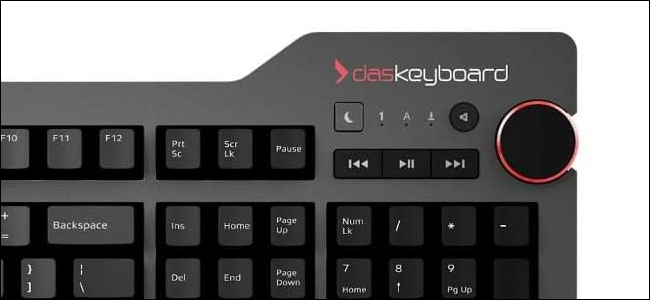 A black keyboard with an oversized volume knob in the upper right corner.