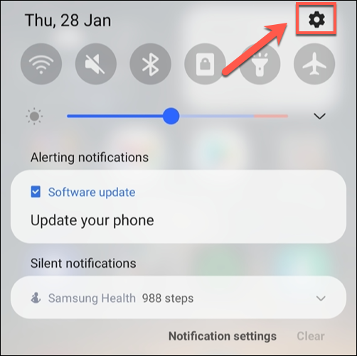 Scroll down to view the notification shade, then tap the gear icon.