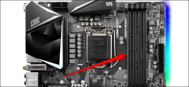 The RAM slots on a motherboard with the red arrow pointing to it.