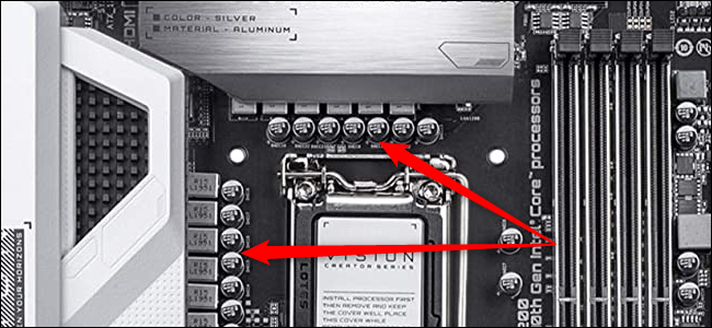 Close-up of a CPU socket with two red arrows pointing to the VRM.