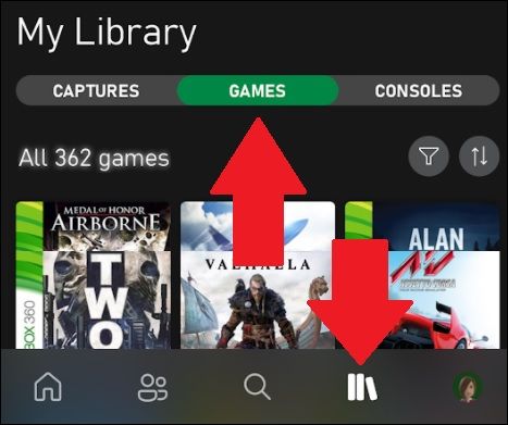 library in xbox app with arrows pointing to library icon and games list
