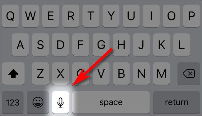 Tap the microphone button on your iPhone or iPad keyboard.