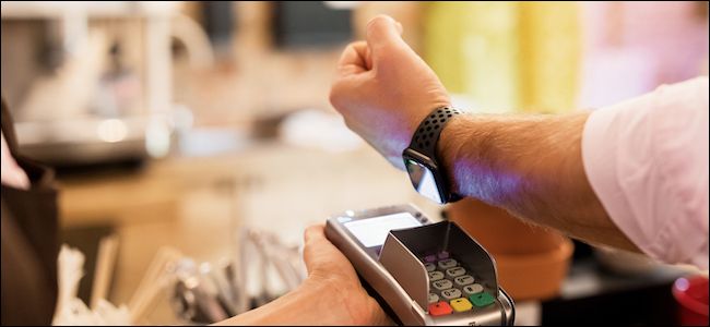 Person using an Apple Watch with Apple Pay