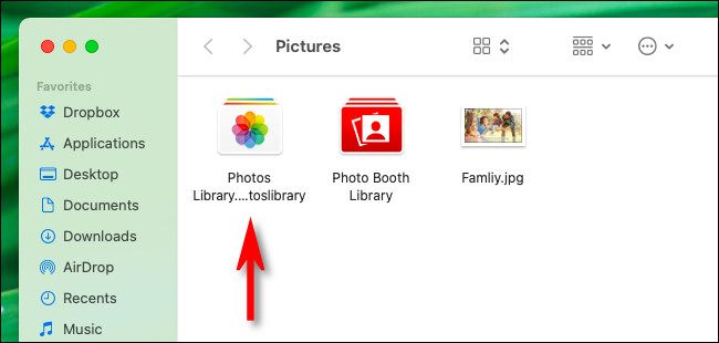 The "Photos Library.photoslibrary" file seen in Finder.