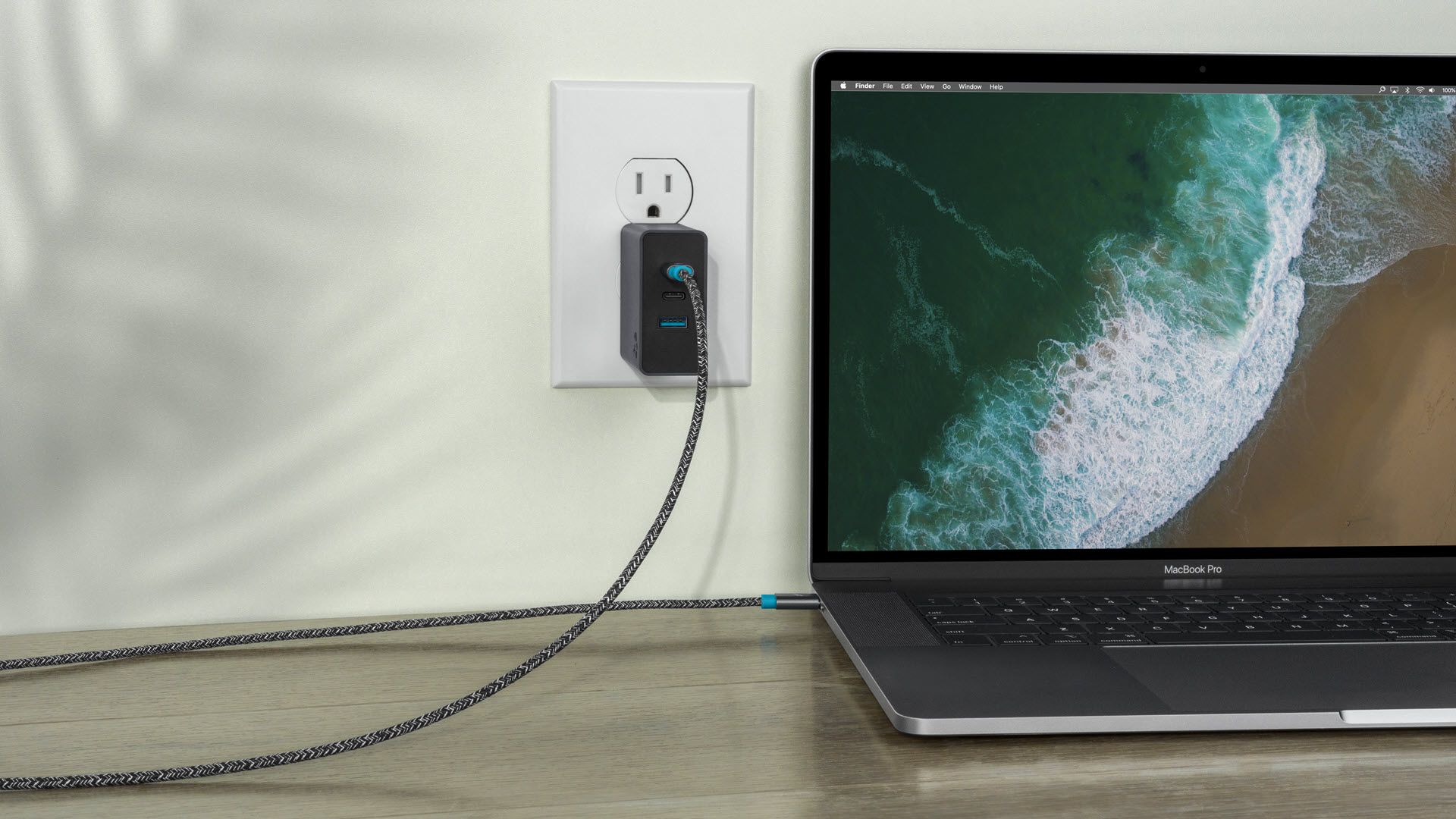A Wally charger plugged into a Macbook Pro